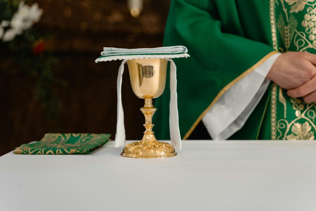 Chalice and host on a Catholic altar symbolizing the Real Presence of Jesus in the Eucharist