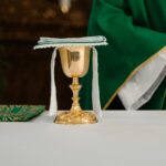 Chalice and host on a Catholic altar symbolizing the Real Presence of Jesus in the Eucharist